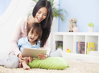 Mother viewing Parent Resources with child